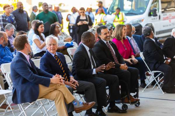 METRO Board Member Angel Ponce (far right) speaks with Board Member Reverend Preston (left) at the Missouri City Park & Ride ribbon cutting ceremony.