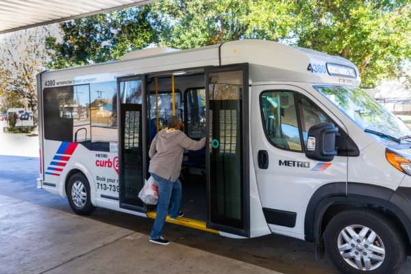 A METRO curb2curb rider boards the vehicle.