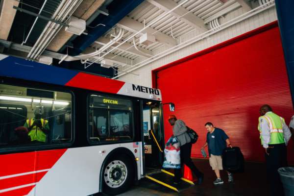 People affected by Hurricane Harvey board a METRO bus to go to a shelter.